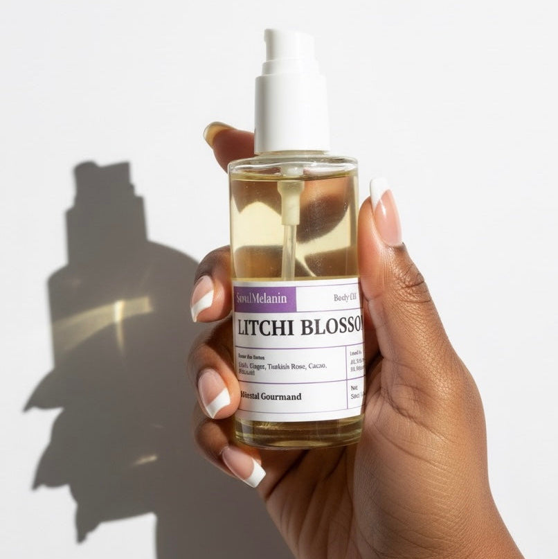 Hand holding a bottle of 'Litchi Blossom' body oil by SeoulMelanin with a white background